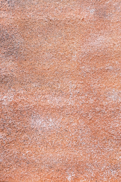 Zdjęcie pianka poliuretanowa jest natryskiwana na ścianę na tło i tapetę, jak tekstura cementu i malowana w pomarańczowym szorstkim stylu na polu zewnętrznym