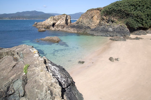 Piasek na plaży Santa Cristina, Espasante, Galicja, Hiszpania
