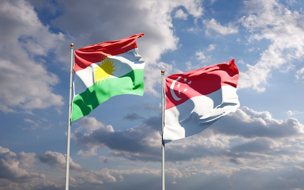 Piękne narodowe flagi państwowe Kurdystanu i Singapuru razem