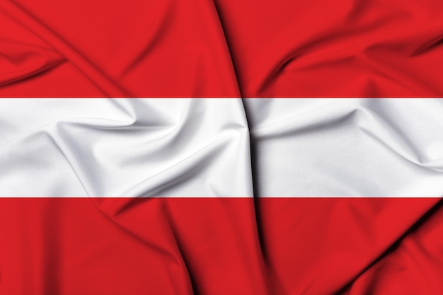 Pięknie machająca i paskowa tekstura tła flagi Austrii z żywymi kolorami