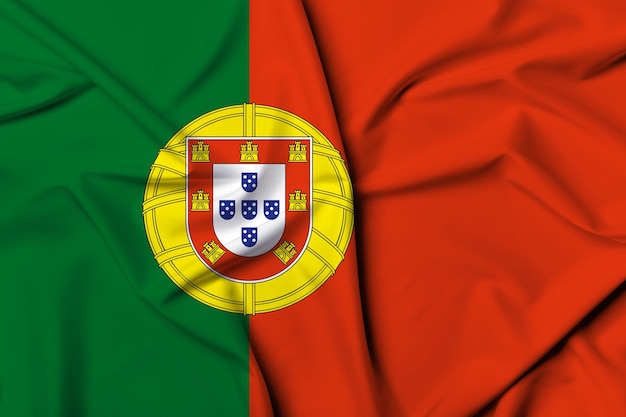 Pięknie machająca i paskowa tekstura tła flagi Portugalii z żywymi kolorami