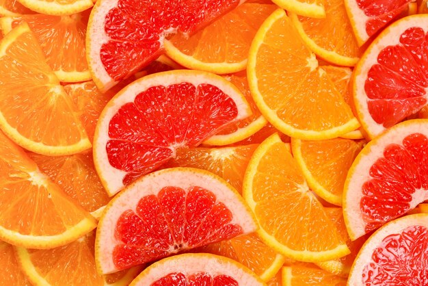 Plasterki pomarańczy i grejpfruta jako tło