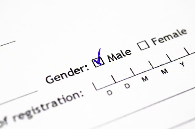 Zdjęcie płeć z bliska, oficjalny dokument męski i żeński w tle