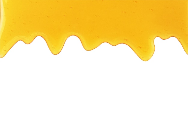 Zdjęcie płynący zbliżenie miód na białym tle rama miodu do projektowania