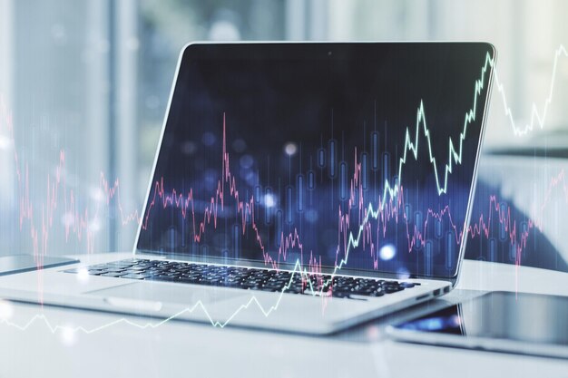 Podwójna ekspozycja abstrakcyjnego kreatywnego diagramu finansowego na nowoczesnej koncepcji bankowości i rachunkowości w tle laptopa