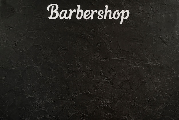 Zdjęcie podwyższony widok zakładu fryzjerskiego słowo na czarnym tle