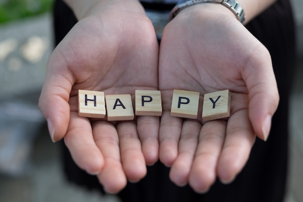 Zdjęcie pojęcie happy - drewniane happy alfabetu