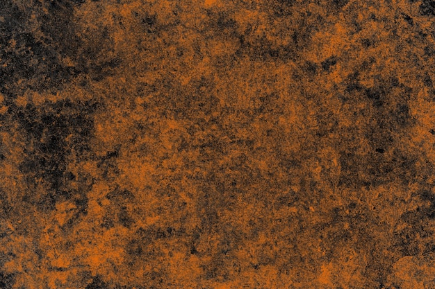 Pomarańczowa teksturowana stara opuszczona betonowa ściana