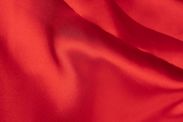 Pomarszczony czerwony jedwab lub satynowa tkanina dla eleganckiego tła z miejscem na kopię Widok z góry dla projektu