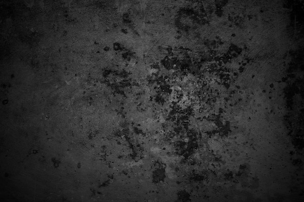 Popękane ściany ciemnoszara betonowa podłoga betonowa jest postarzana w koncepcji retro Tekstura grungy czarnej betonowej ściany jako tła