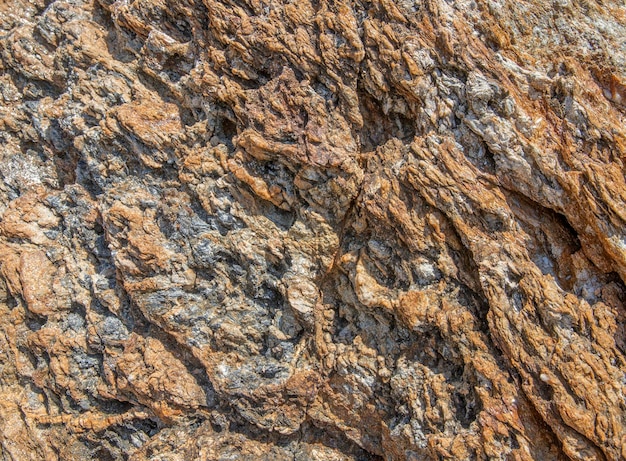 Powierzchnia skały naturalnej lub kamienia jako tekstura tła z bliska
