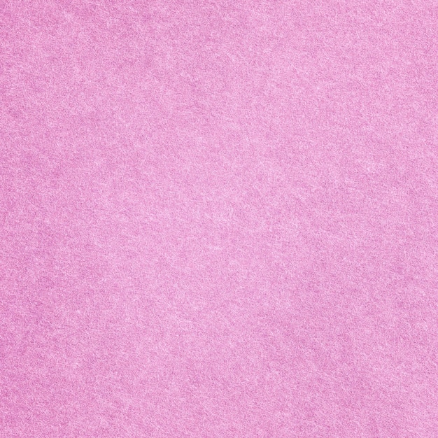 Powierzchnia tła z makroteksturą różowego papieru