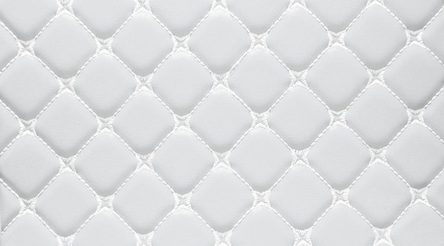 Zdjęcie prawdziwy luksus eleganckiej kwadratowej sofy samochodowej z białym skórzanym wzorem w stylu vintage poduszkimeble tapicerowane w stylu retro z wzorem nicibiałe skórzane wyściełane tłozbliżenie