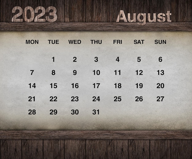 Zdjęcie projekt kalendarza na rok 2023. grunge ściany na tle drewna. zestaw 12 kalendarzy.