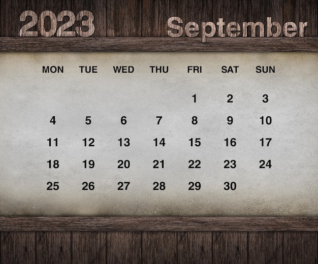 Zdjęcie projekt kalendarza na rok 2023. grunge ściany na tle drewna. zestaw 12 kalendarzy.