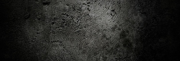 Przerażające ciemne ściany lekko jasna czarna betonowa tekstura cementu na tle Zadrapania pędzlem na ścianie