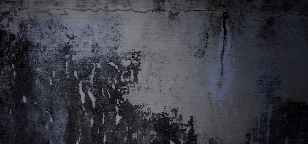Przerażający ciemny cement na tle. stare ściany pełne plam i zadrapań