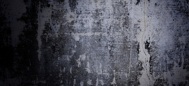 Przerażający ciemny cement na tle. stare ściany pełne plam i zadrapań