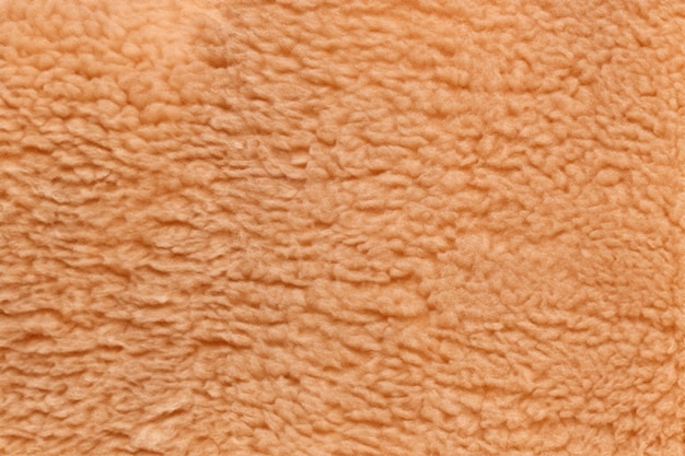 Zdjęcie przyjemna tekstura miękka jasna brązowa tkanina z niedźwiedzia