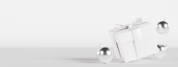 Pudełko i srebrna dekoracja świąteczna na białym tle z pustym miejscem na tekst Obecny baner świąteczny z miejsca na kopię Minimalistyczny design Szablon zaproszenia z życzeniami Renderowanie 3D