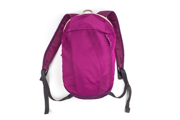 Purpurowy szkolny plecak na odosobnionym białym tle