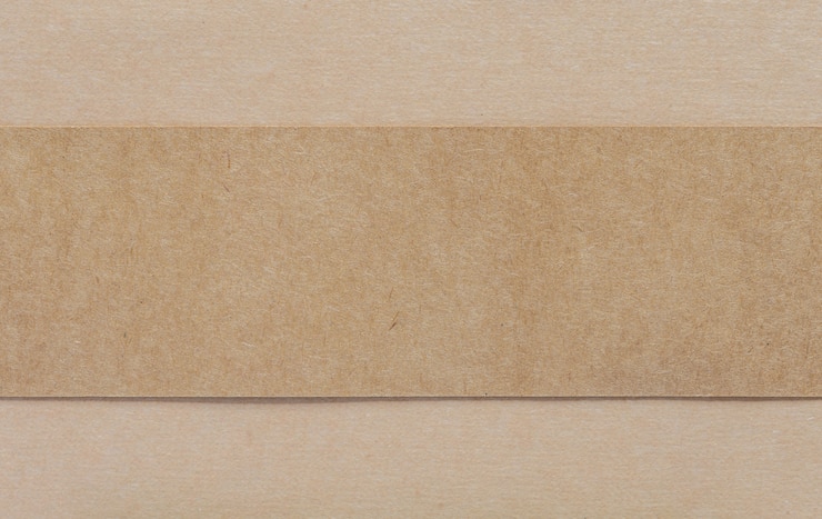 Zdjęcie pusty brown papier na brown cardboad tle
