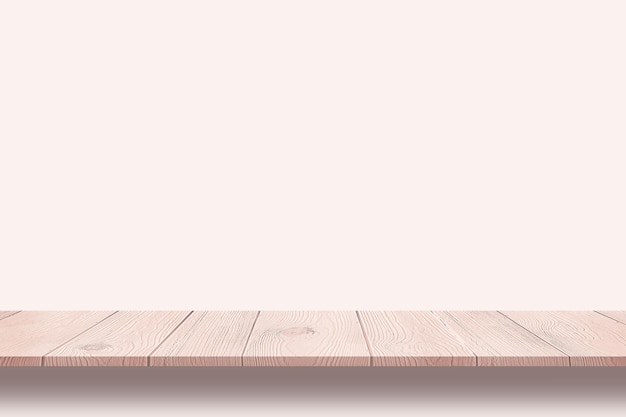 Pusty drewniany stół może służyć do prezentowania produktów w pastelowym tle
