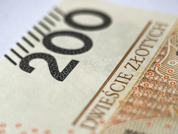 Zdjęcie rachunek 200 zł w zbliżeniu na białym tle odizolowane. polska waluta