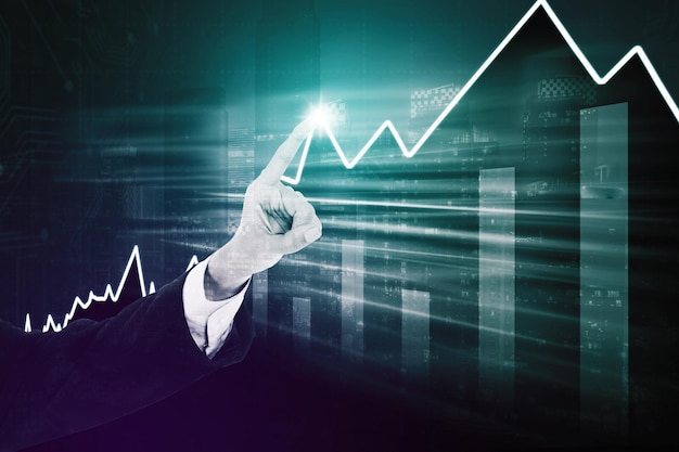 Ręka biznesmena dotyka wykresu finansów