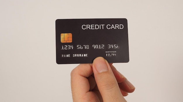 Ręka Trzyma Czarną Kartę Kredytową Na Białym Tlex9