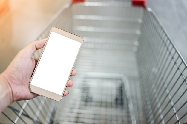 Ręka Używać Smartphone Z Plamy Tłem Supermarket