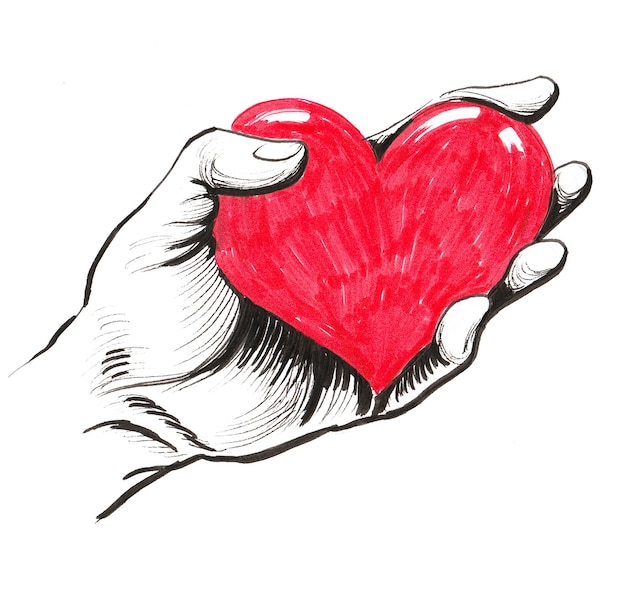 Zdjęcie ręka z czerwonym sercem. rysunek tuszem