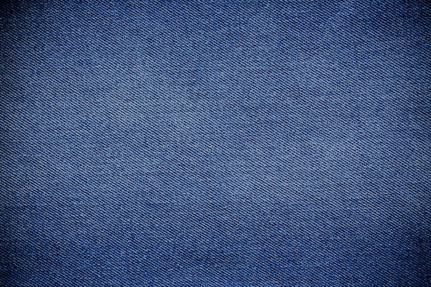 Retro odcień koloru niebieskiego denimu dżinsów tkaniny tekstury dla tła strony internetowej projektowania mody lub produktu w tle