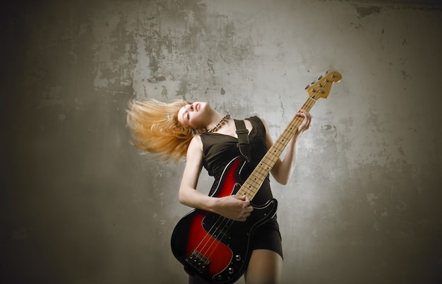 Zdjęcie rocker girl with a guitar