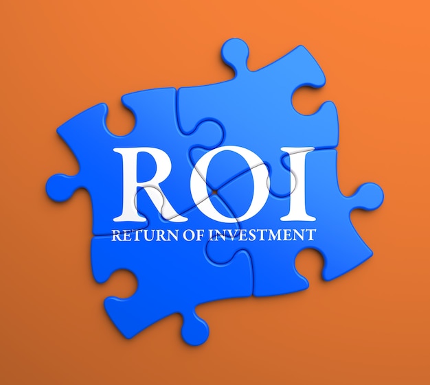 Zdjęcie roi - zwrot z inwestycji - napisane na niebieskich elementach układanki. pomysł na biznes.