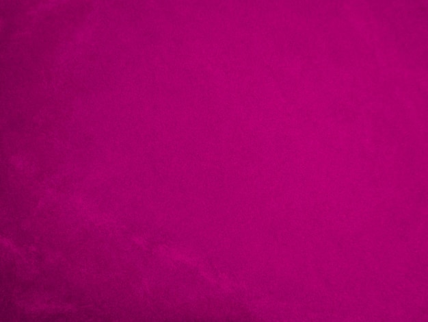 Różowa aksamitna tekstura tkaniny używana jako tło Tło tkaniny panne w kolorze wina z miękkiego i gładkiego materiału tekstylnego zgnieciony aksamitny luksusowy odcień magenty dla jedwabiu
