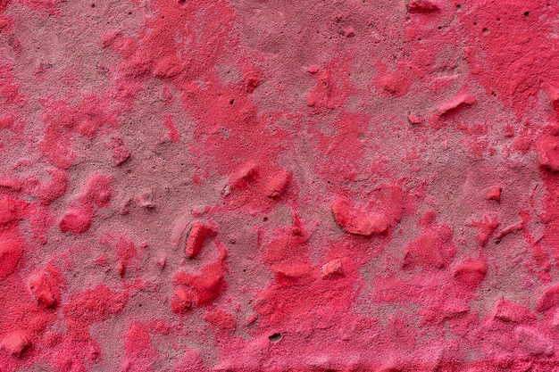 Różowa betonowa ściana Betonowa ściana jest malowana natryskowo na różowo