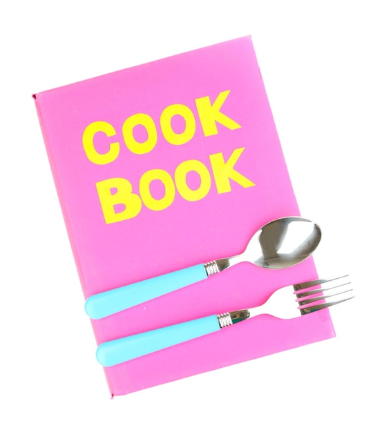Różowa książka kucharska i przybory kuchenne na białym tle
