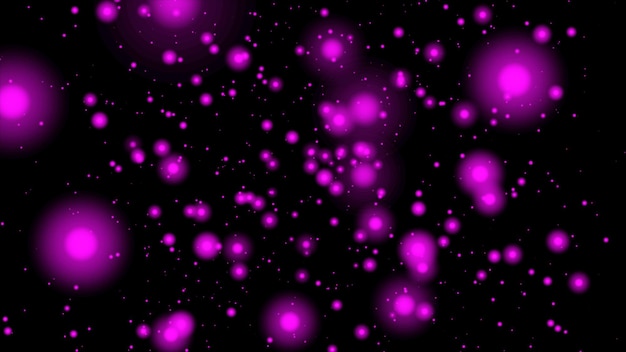 różowe latające cząsteczki na czarnym tle