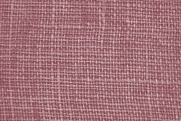 Różowo-biała tkanina z plecionym wzorem.