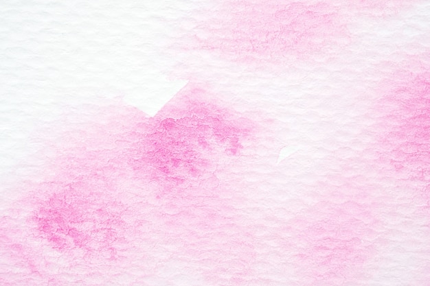 Różowy abstrakcyjny akwarela obraz teksturowane na białym tle papieru