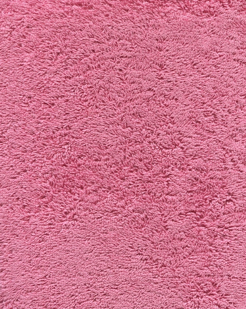 Różowy kolor ręcznik kąpielowy tekstury Różowy ręcznik kąpielowy w tle