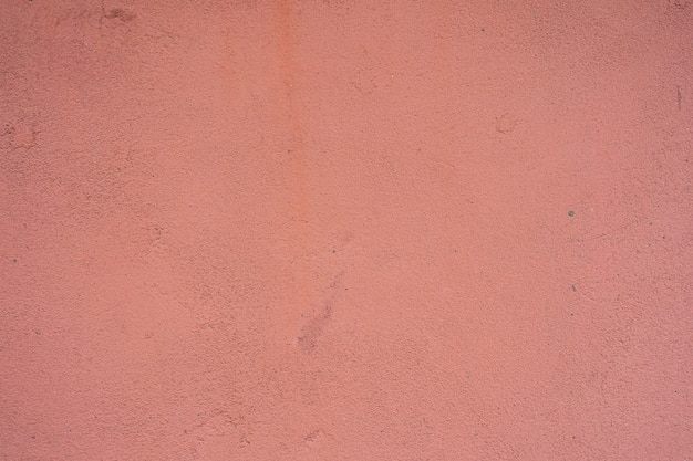 różowy tynk ściana tekstur. pomalowana powierzchnia stiuku