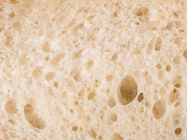Rustic close-up naciętej tekstury chleba z widoku z góry złota skorupa chleba pszenicznego