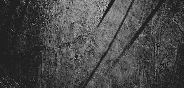 Zdjęcie Ściana pełna zadrapań grungy cementowa tekstura na tło straszna ciemna ścianaczarna ściana