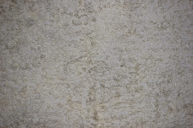 Ściana tła o teksturze szorstkiego cementu