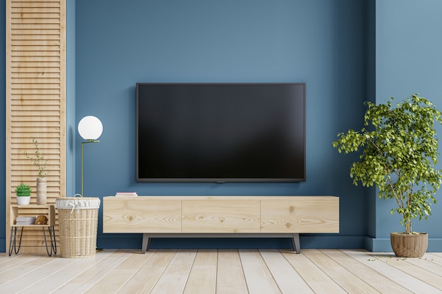 Ściana TV montowana na szafce w salonie z ciemnoniebieską ścianą