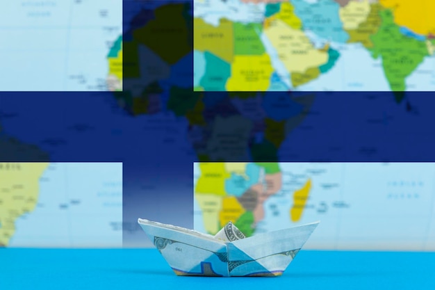 Zdjęcie sea transport of finland concept international transportation trade or imports paper ship with