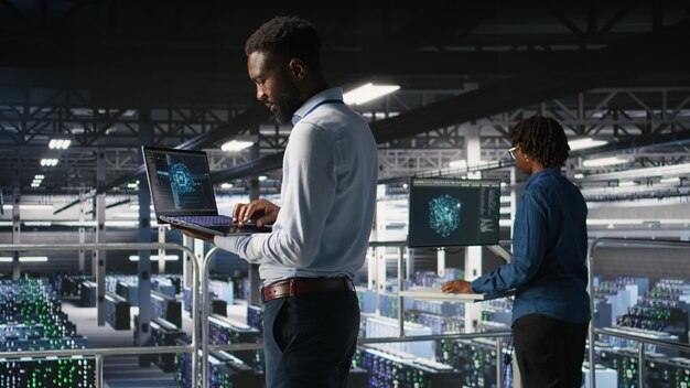 Server hub teamworking it experts visualizing large language model architecture using notebook data