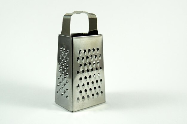 Zdjęcie small metal grater on a white background